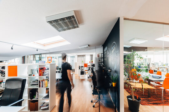 Modern open office interior with motion blur employee