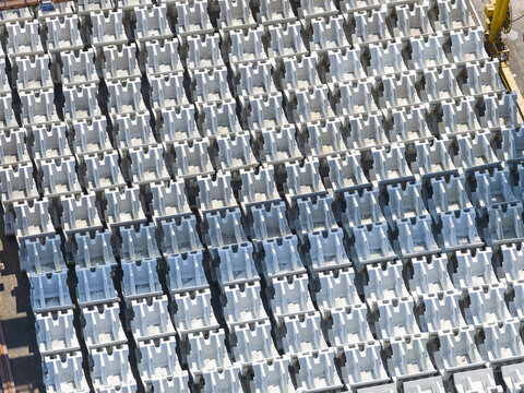 Aerial view of rows of concrete breakwater tetrapods stacked in a harbor area Taiwan.