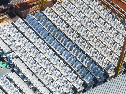 Aerial view of rows of white prefabricated structural components neatly arranged at an industrial construction site Taiwan.