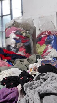 Bales of discarded children clothes highlighting textile waste