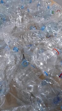 Pile of used plastic water bottles for recycling and environmental protection