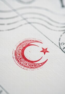 Close-up of a red Turkish crescent moon and star stamp with Istanbul text