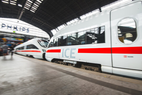 Hamburg, Germany - July 30 2016: Modern ICE high speed train arriving at busy station platform.