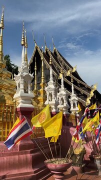 Golden Stupa and Flags Outside Thai Temple (Chiang Mai, Thailand)
