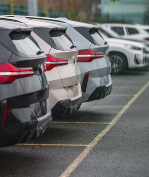 Gothenburg, Sweden - March 08 2026: Row of modern BMW SUV vehicles parked diagonally in parking lot.