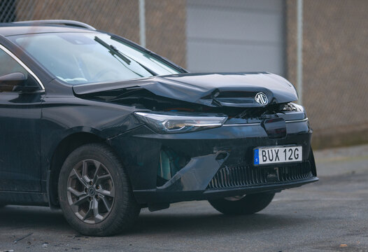 Gothenburg, Sweden - March 15 2026: 2022 MG MG5 Electric with front end collision damage.