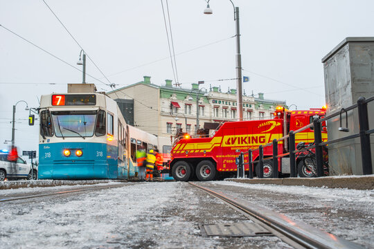 Gothenburg, Sweden - december 06 2013: Low angle view of tram recovery operation on icy tracks.