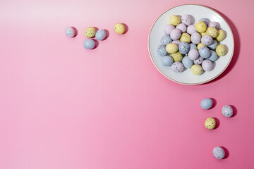 Obraz premium Mini Speckled Chocolate Easter Eggs on Pink Background