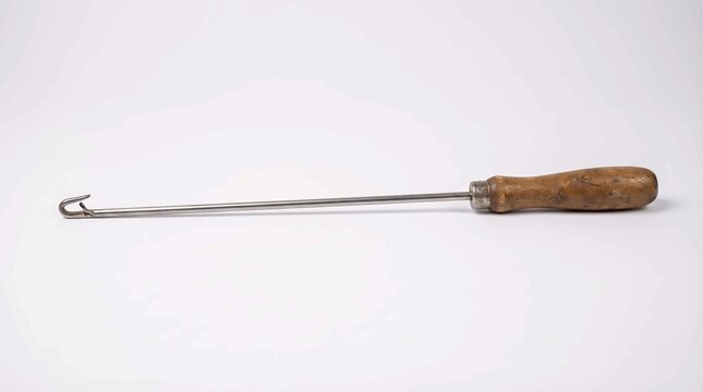 Vintage Steel Button Hook with Wooden Handle on White Background