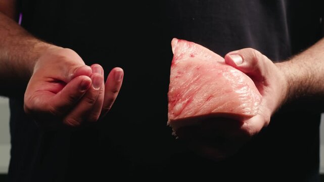 Raw lamb sheep fat tail fat on wooden board, close up of middle eastern pork or lamb dish. Rotating macro meat. 