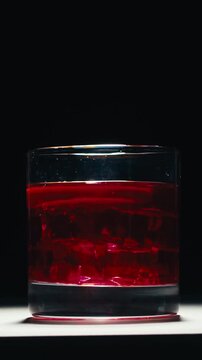 Vermouth Negroni, spanish wine drink, Alcoholic Americano Cocktail bitter, sweet vermouth and soda water, close up of making drink, summer spanish vacations. 