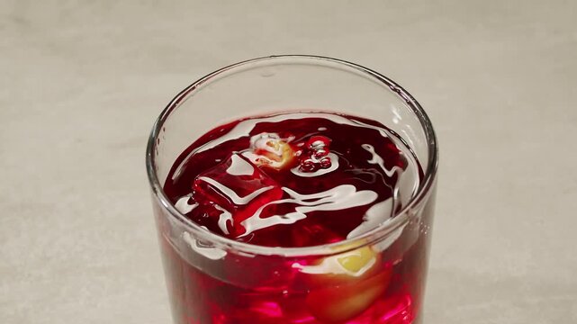 Vermouth Negroni, spanish wine drink, Alcoholic Americano Cocktail bitter, sweet vermouth and soda water, close up of making drink, summer spanish vacations. 
