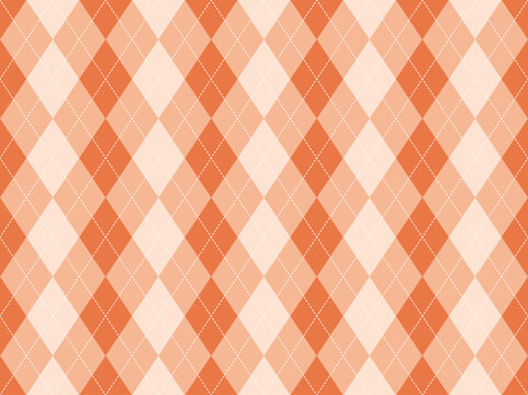 Argyle pattern seamless background in orange for fall fashion