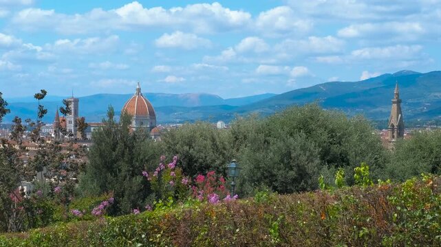 Florence cathedral and giotto's campanile rising above the city seen from bardini garden. Wonderful view of florence city center with brunelleschi's dome and giotto's bell tower rising above the roofs
