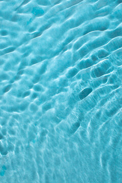 Vibrant blue wave water background, creative curve texture style. Vertical abstract background.