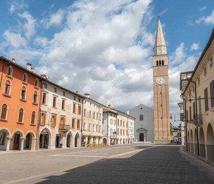 Panoramic view of Piazza del Popolo in San Vito al Tagliamento, featuring the Cathedral of Saints Vito, Modesto and Crescenzia and its tall Renaissance bell tower, Pordenone, Italy
