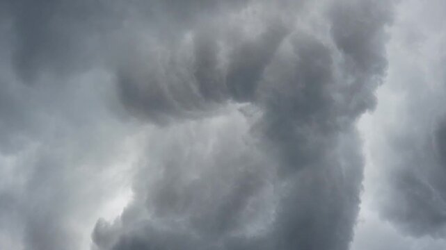 Dark dense storm clouds, dramatic threatening sky close-up