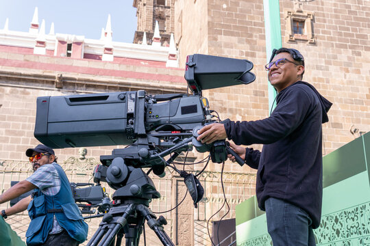 Camera operator filming live television broadcast production