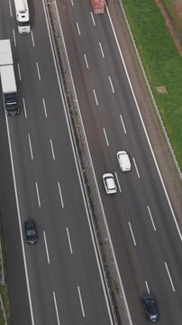 Aerial view of highway traffic flow on A50 ring road in northern Italy.