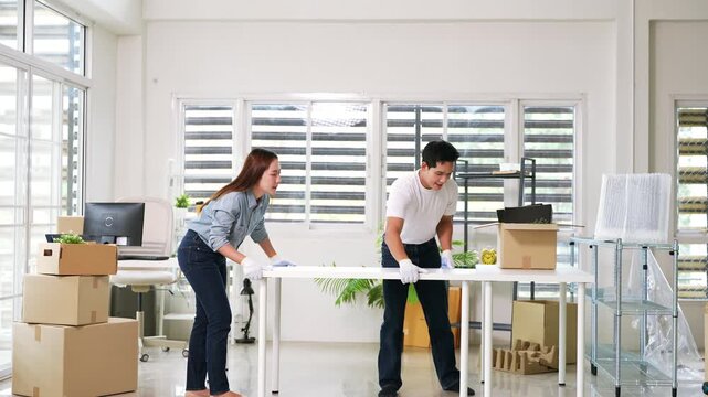 Moving day. Employees are moving their belongings into the new office.