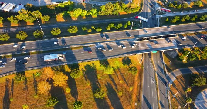 Highway with traffic moving along curved multilane road in the United States. Transportation network illustrating speed, commute and modern infrastructure.