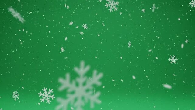 Falling snowflakes on a vibrant green background, perfect for winter holiday season celebrations