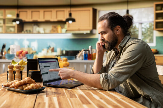 Adult man calling customer support for delayed shipment online tracking, real time updates and filing complaint for transport issues. Concern over lost package and shipping service errors.