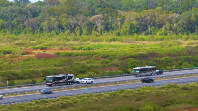 Motorhome camper recreational vehicle driving on American freeway at high speed. USA travel transportation infrastructure.