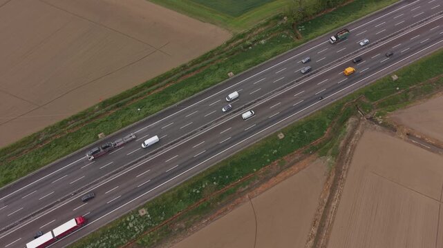 Aerial view of heavy traffic flow on A50 ring road near Milan in northern Italy. Transport infrastructure supporting logistics movement, mobility systems and regional connectivity.