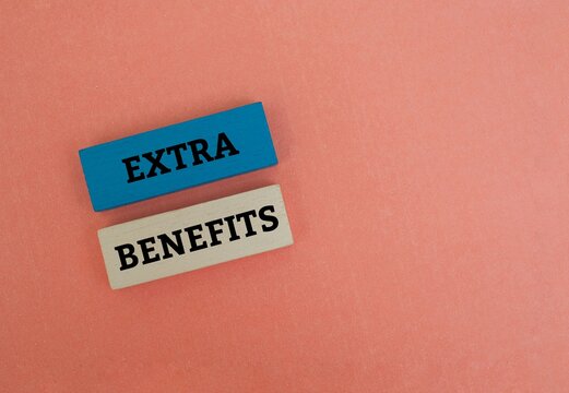 Colorful blocks with text EXTRA BENEFITS. Concept for employee perks, compensation and value-added services