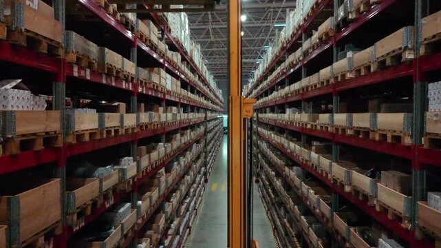 Drone rising inside warehouse aisle with forklift