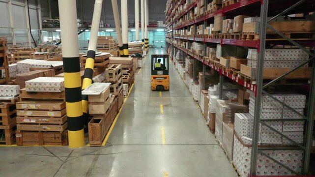 Drone following forklift in large warehouse area