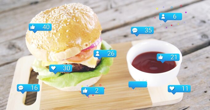 Showing sesame-seed burger sitting on cutting board on rustic table, with ketchup and social icons