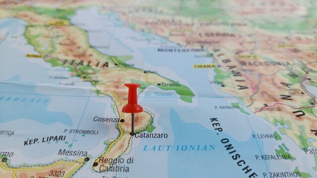 View of Catanzaro, Italian city and capital of the Calabria province, on a geographical map of Europa, marked with red push pin