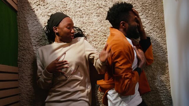 Top down view of black couple fighting with rage and frustration, African American partners upset struggling with relationship conflict and unhappy emotions. Enraged domestic life with drama.