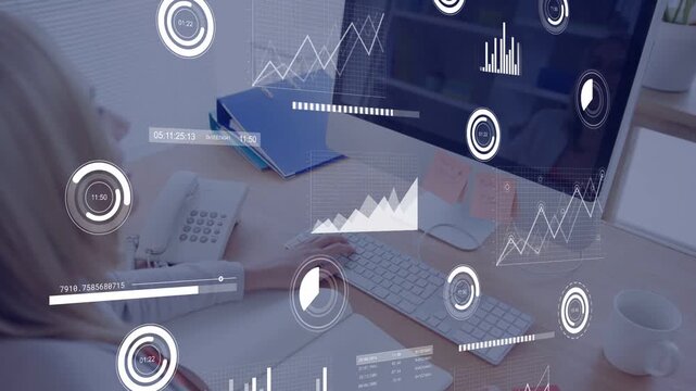 Woman typing and writing notes, starting business graphs floating over monitor while analyzing data