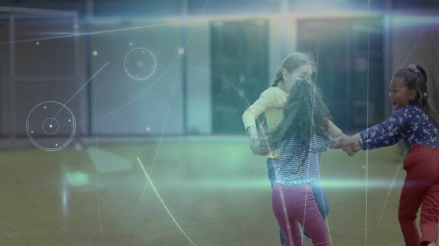 Joining hands, three girls spinning and turning clockwise on grassy lawn with light streak overlay
