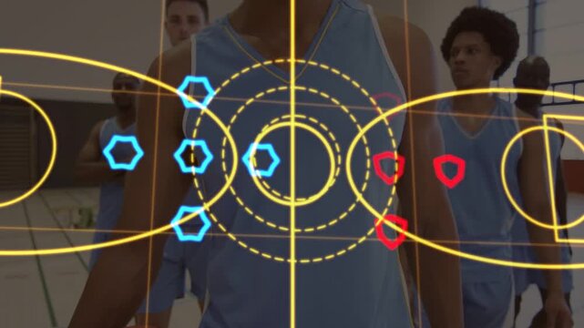 Holding basketball, center player at gym, overlay appearing showing tactics, team in blue uniforms