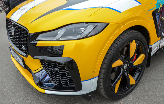 Yellow Jaguar F-Pace SVR high performance SUV stands out with its aggressive front grille and custom black and yellow alloy wheels