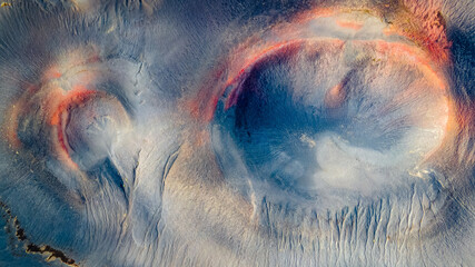 Abstract Aerial of Volcanic Craters with Red Tones © Nils