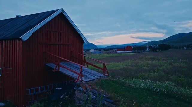Kokelv, Hammerfest, Finnmark, Norway - The Peaceful Village Rests by the Shore, With Colorful Houses Dotting the Landscape - Drone Flying Forward