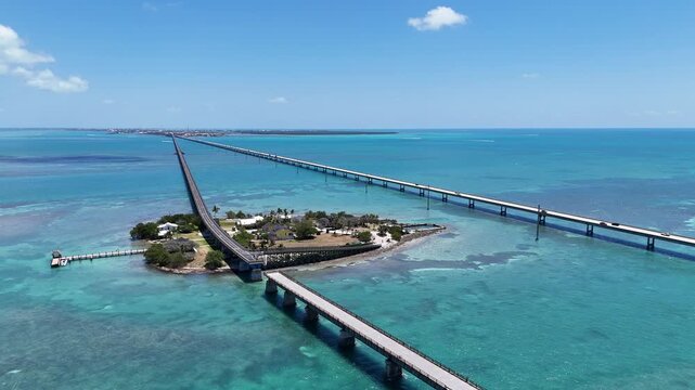 Aerial view of old seven mile bridge and the newer bridge with Pigeon Key between them in the Florida Keys.