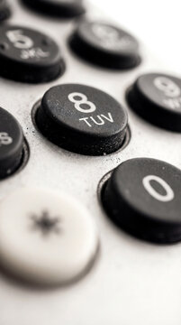 Macro of Vintage Telephone Keypad Number Eight in Grayscale