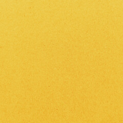 Obraz premium Vibrant textured yellow background with copy space