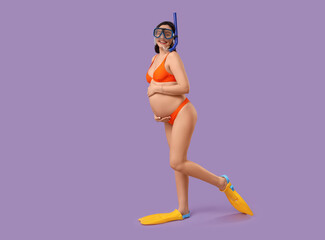 Young pregnant woman in swimsuit with flippers and swimming mask on lilac background. Traveling concept © Pixel-Shot