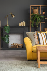 Obraz premium Interior of living room with decorative mantelpiece and sofa