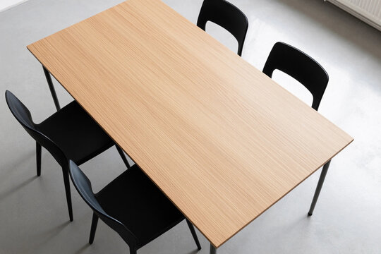 Warm wooden table with matching chairs.