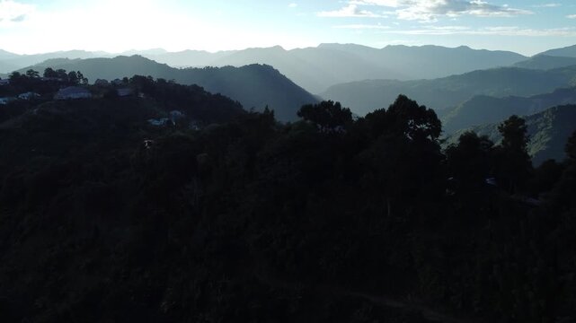 The light of the sunset has created parallel lines on the hills.