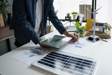 Engineer Design green energy technology with solar panel and wind turbine © Wanda