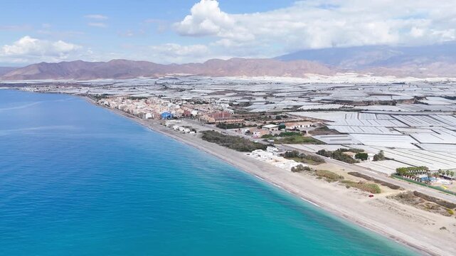coast industry city beach vacation sea greenhouse field agriculture invernaderos plastic sea mountain drone travel landscape - Andalusia, Spain - 2025